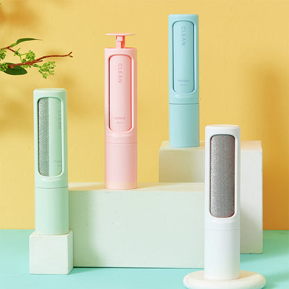Four cylindrical cleaning devices in pastel colors on a geometric platform with a yellow and blue gradient background.