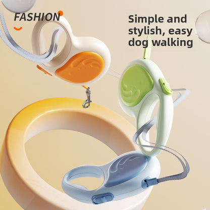 Dog walking device with colorful handles on a beige background, featuring text about simple and stylish dog walking.