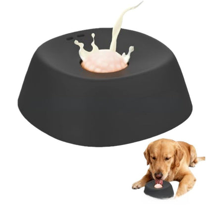 Black dog toy with a splash of milk and a dog eating from it on a white background